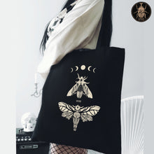 Load image into Gallery viewer, Death head moths gothic tote bag worn by a goth goblincore girl.

