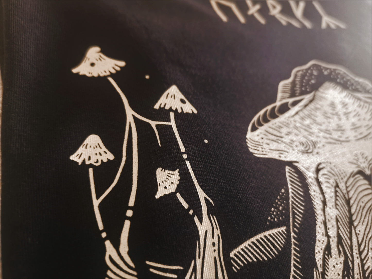 cute mushrooms which are screen printed on a gothic aesthetic t-shirt 
