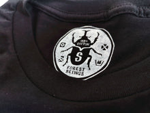 Load image into Gallery viewer, Our soft to the touch, screen printed neck tags with our cute beetle logo. 

