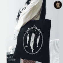Load image into Gallery viewer, Sleeping sperm whales print on a black aesthetic gothic tote bag worn by a gothic girl. 
